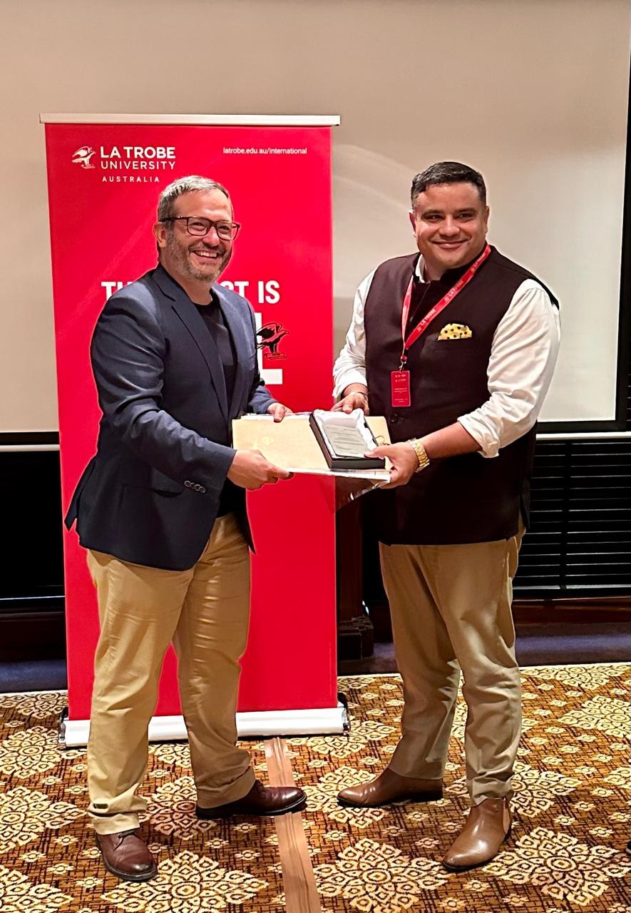 Mitesh Malhotra receiving university recognition award 3
