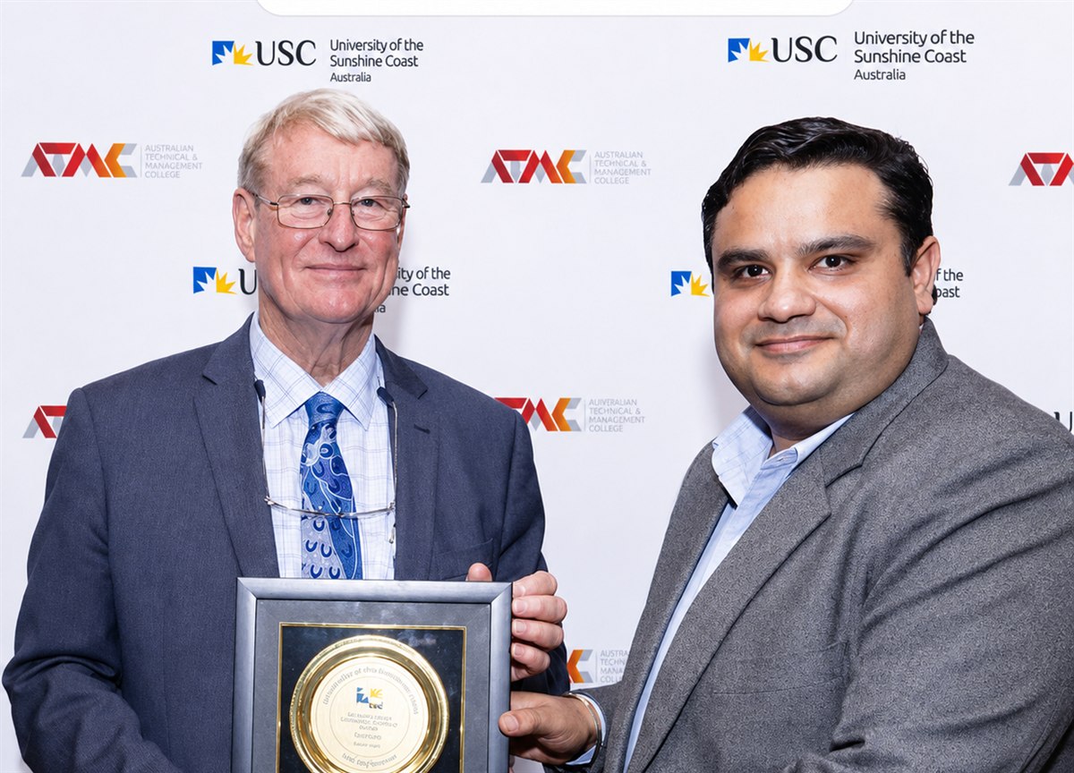 Mitesh Malhotra receiving University of the Sunshine Coast recognition award