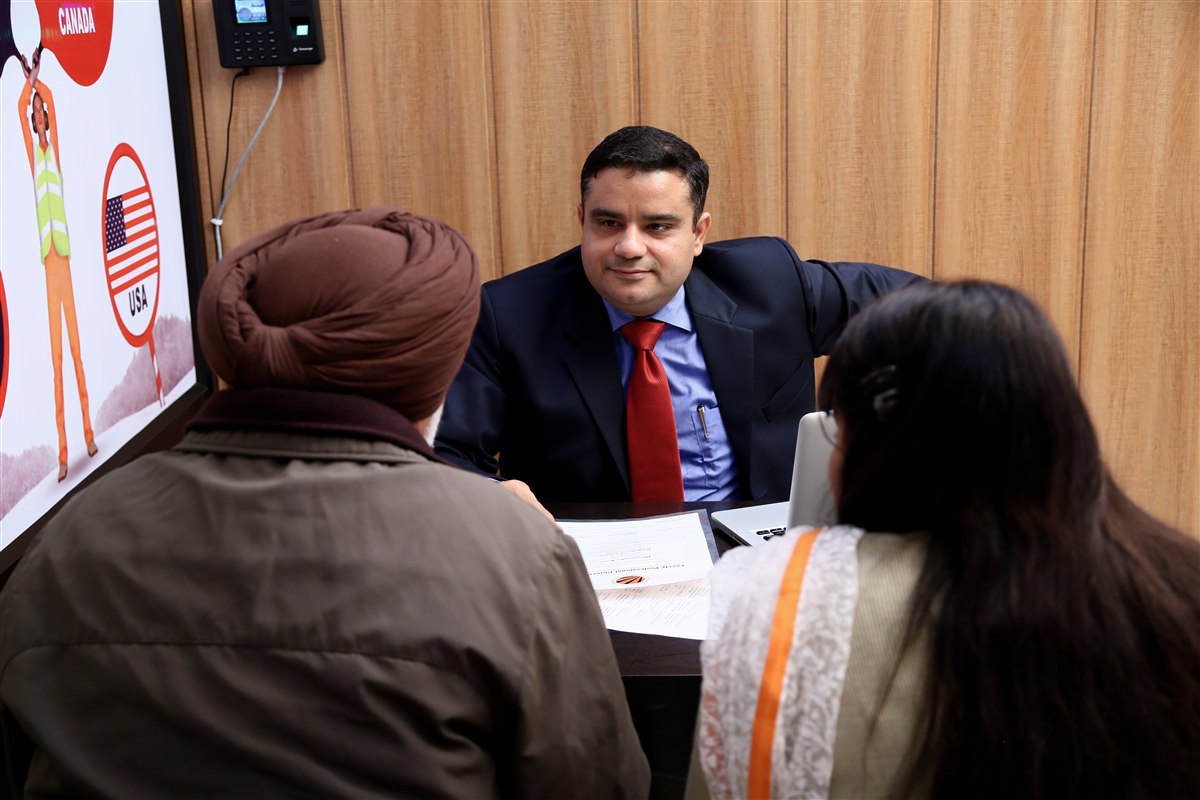 Mitesh Malhotra counselling a Class 12 student and parents on career and university options