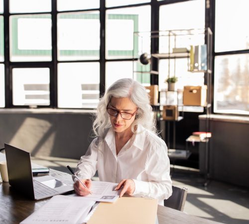 HR Manager Woman Reading Candidates Profiles Sitting At Workplace Indoors HR Manager Woman Reading Candidates Profiles Sitting At Workplace Indoors